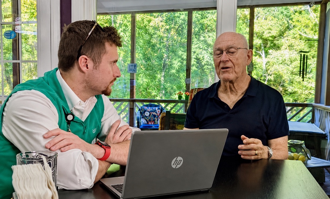 Preston with Dan discussing his plant and flower business