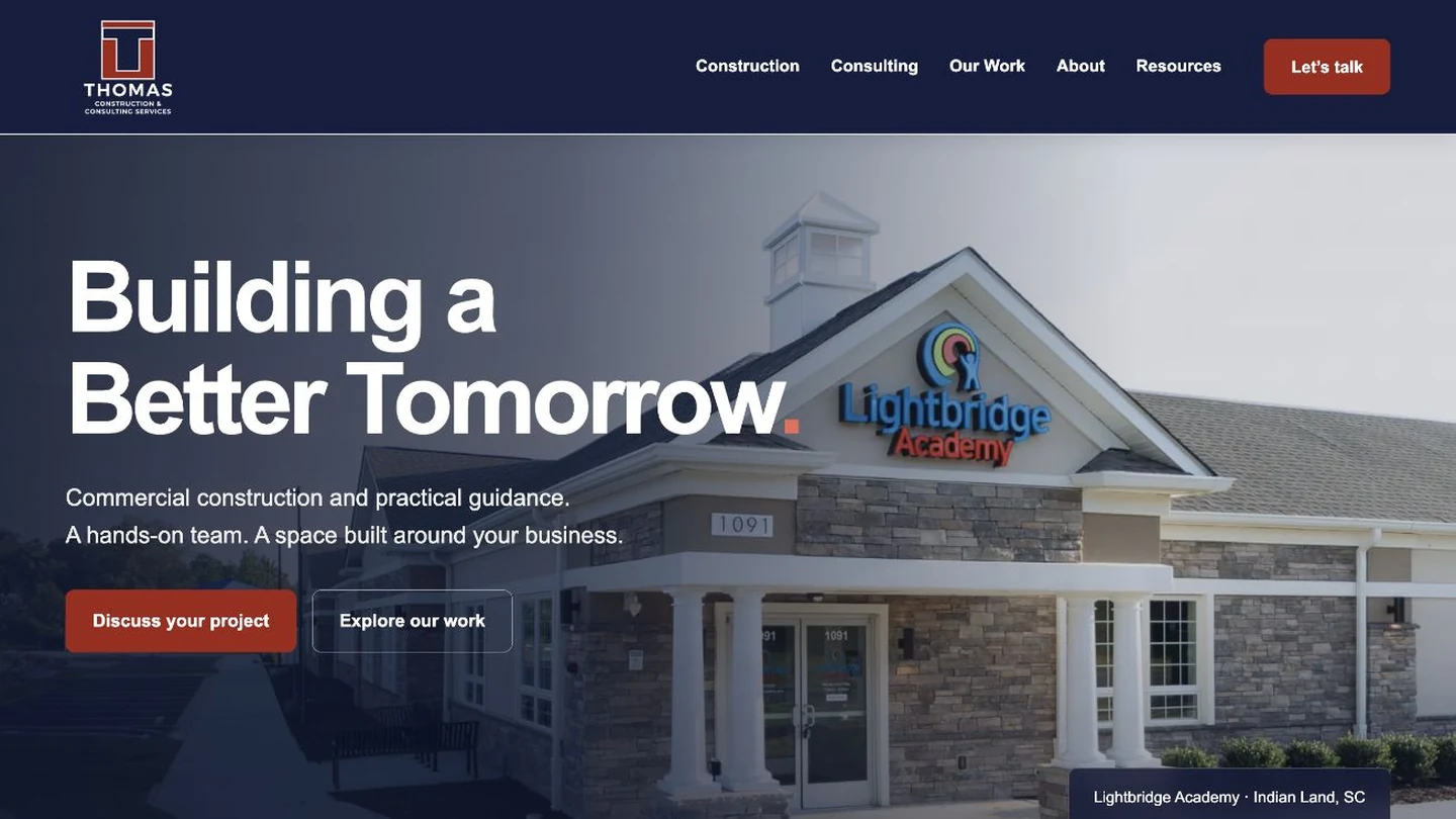 Thomas Construction website mockup with the Building a Better Tomorrow headline and a completed commercial building